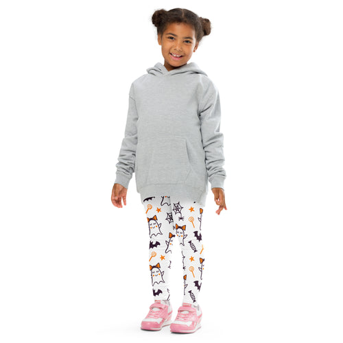 Girl wearing a gray hooded sweatshirt with long sleeves and front pocket paired with cute ghost bow buttery soft leggings