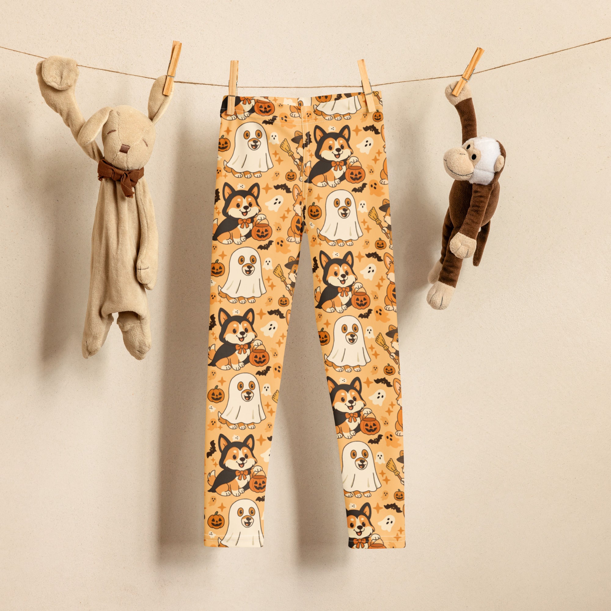 Kids corgi dog ghost halloween buttery soft leggings in orange with playful black and white corgis in vampire costumes