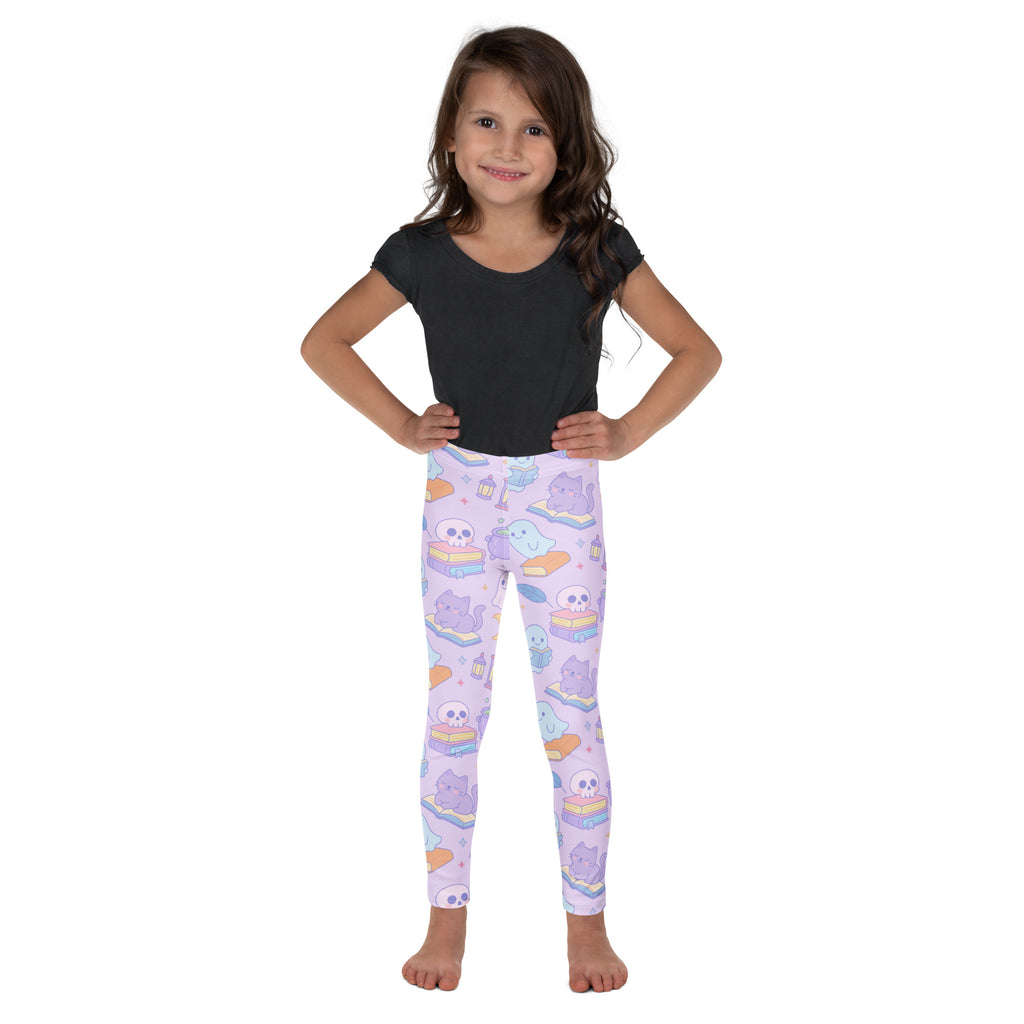 Pastel lavender girls halloween leggings with cartoon cats skulls ghosts on stacked books buttery soft fabric