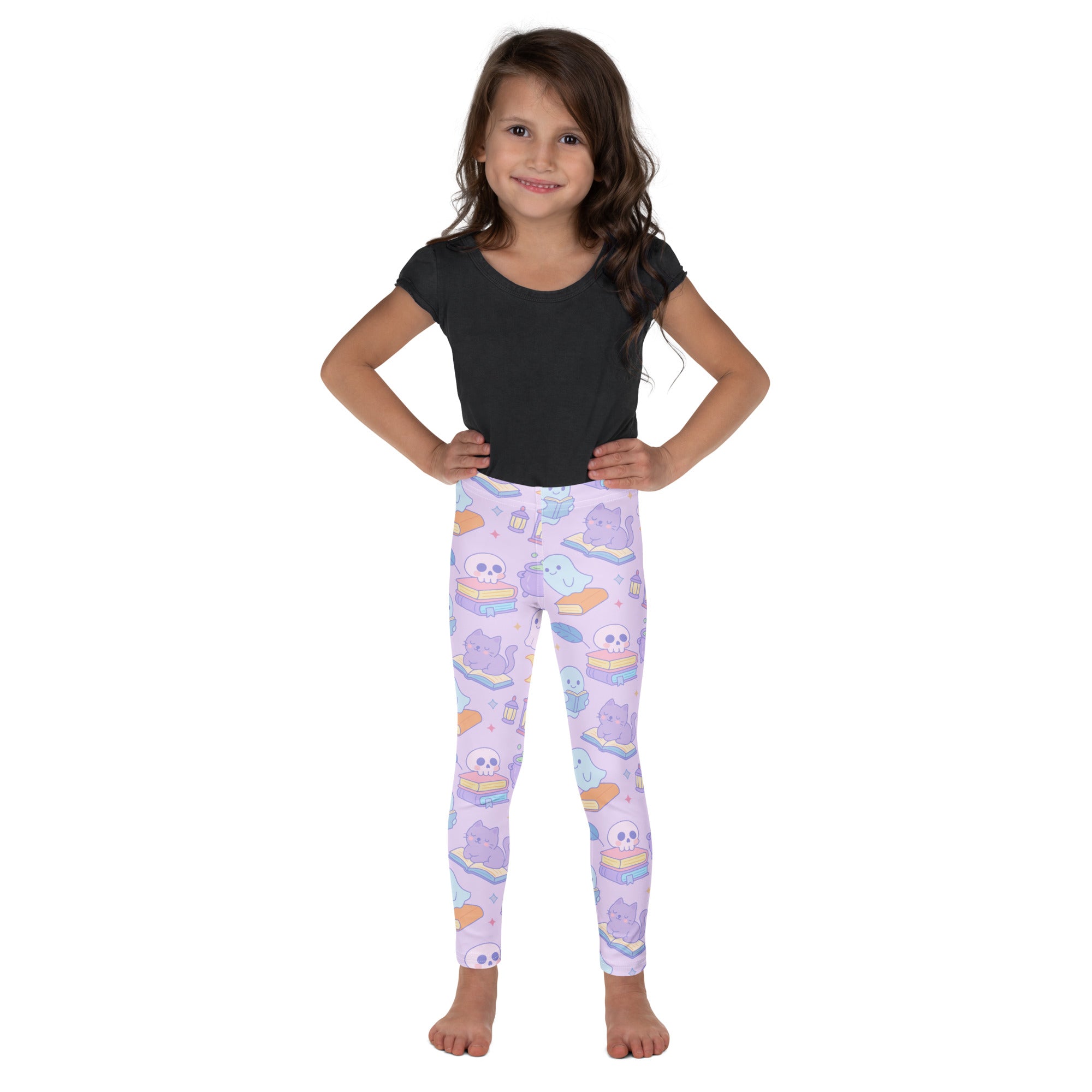 Pastel lavender girls halloween leggings with cartoon cats skulls ghosts on stacked books buttery soft fabric