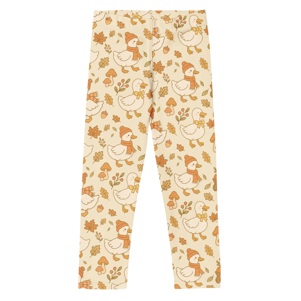 Cream-colored kids fall goose buttery soft leggings with cartoon ducks orange scarves autumn leaves and mushrooms pattern