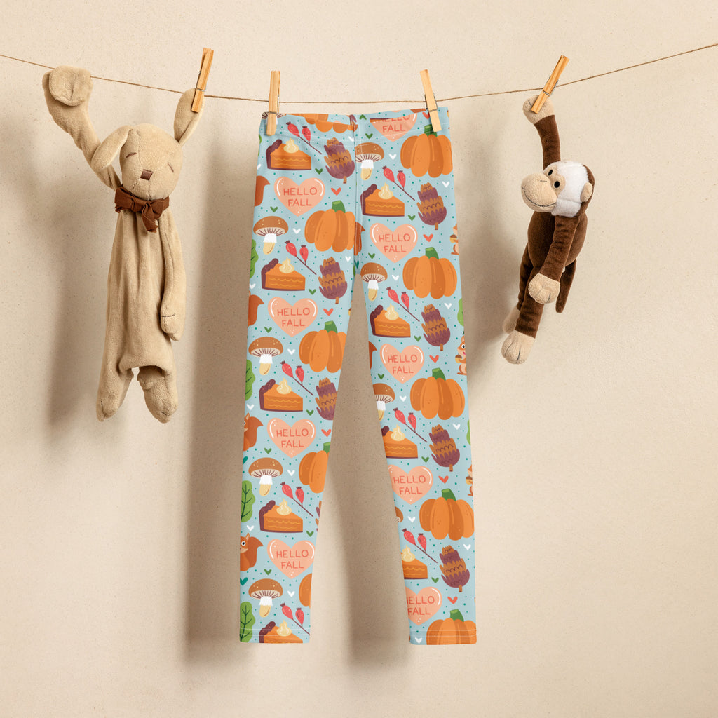 Girls hello fall autumn buttery soft light blue leggings with playful orange pumpkins pie slices and mushrooms pattern