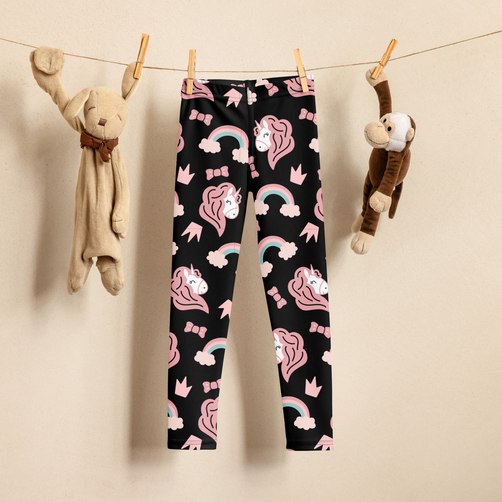 Girls unicorn rainbow buttery soft black leggings with playful pink unicorns rainbows and crowns pattern