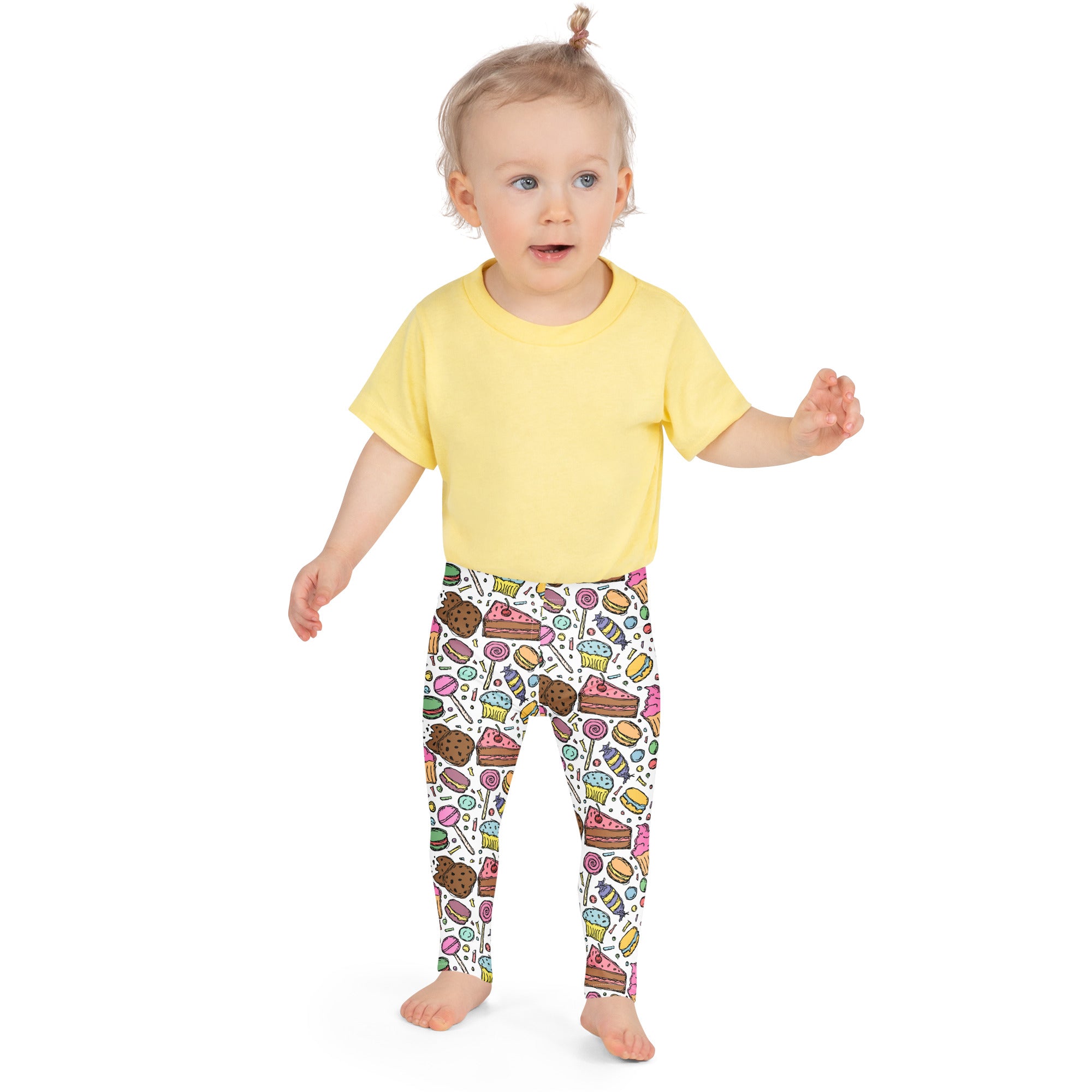 Yellow short-sleeved t-shirt with girls candy and dessert buttery soft white leggings featuring colorful cartoon sweets