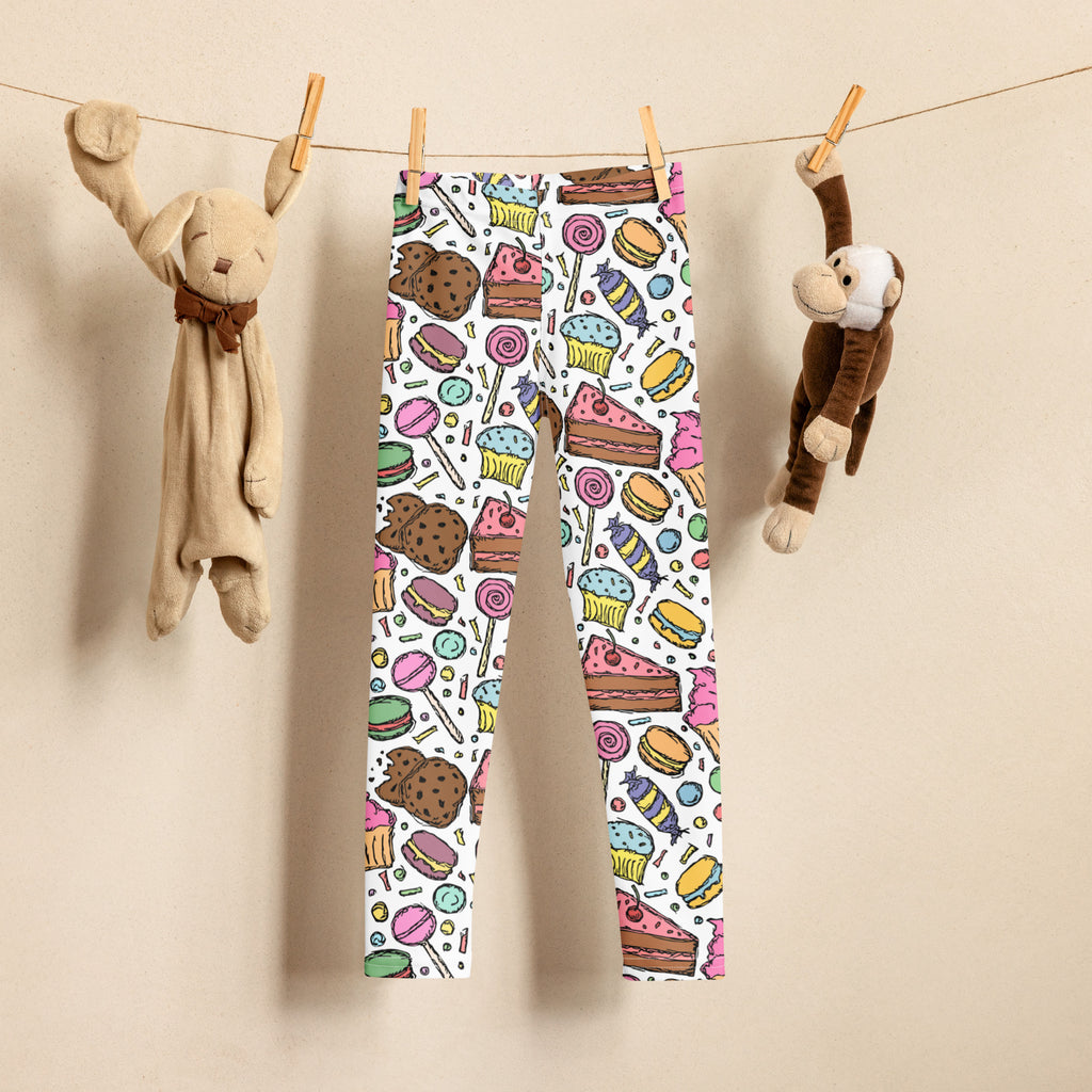 Girls candy and dessert buttery soft white leggings with a colorful playful cartoon pattern of cupcakes lollipops and sandwiches
