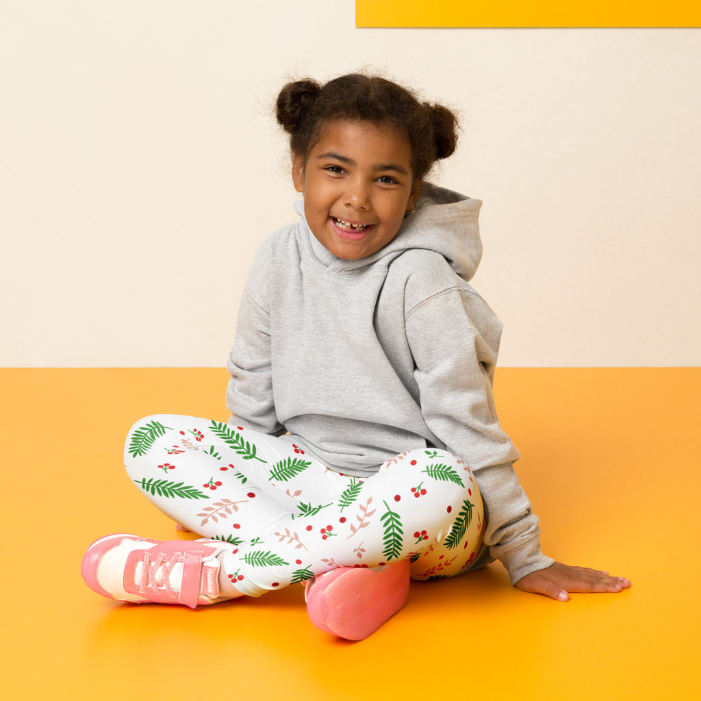 Gray hooded sweatshirt with a soft casual fit paired with kids holly and pine buttery soft christmas leggings