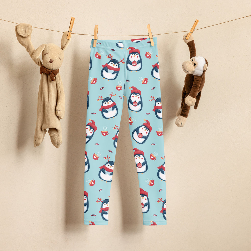Light blue buttery soft girls leggings with cute penguin and candy cane Christmas pattern