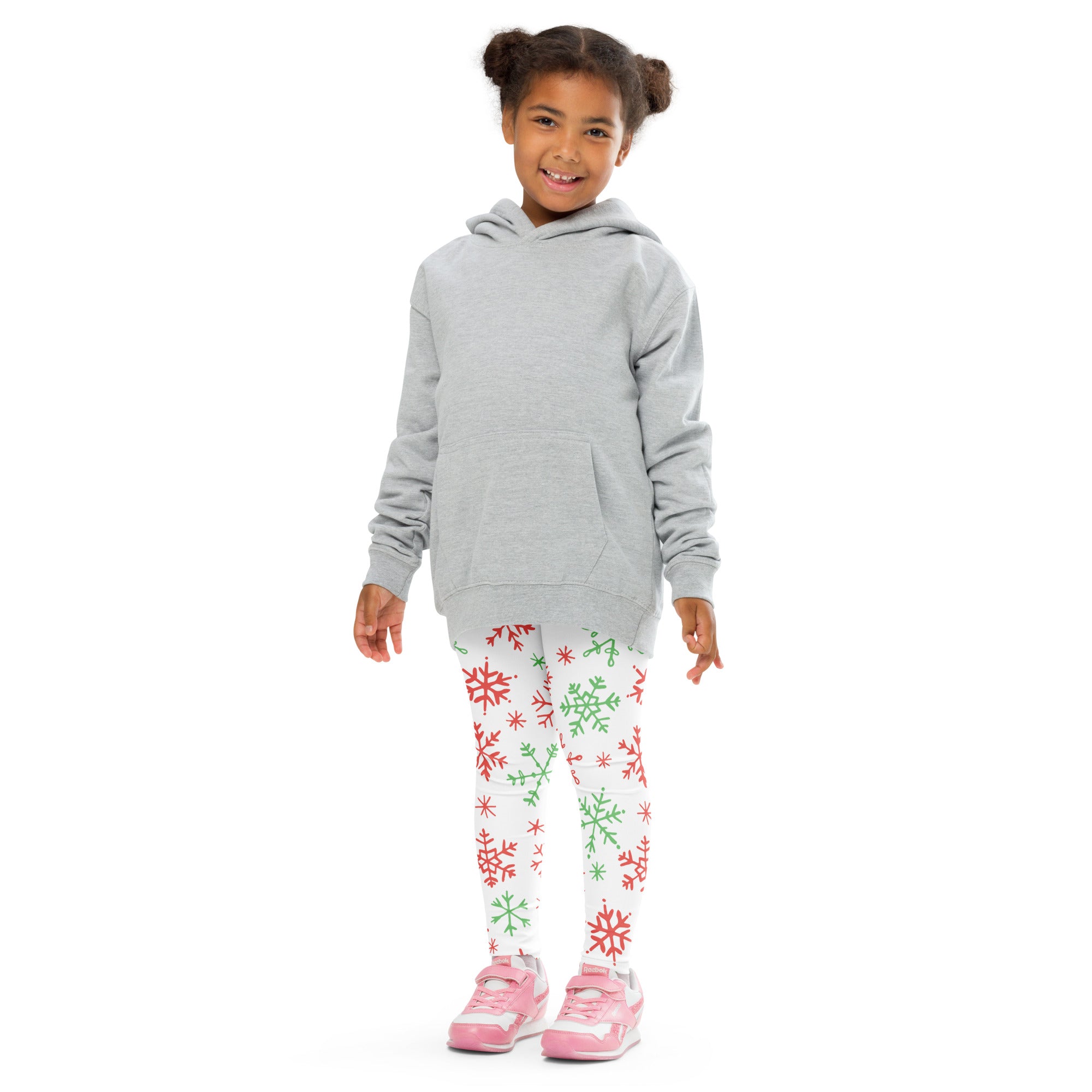 Gray hooded sweatshirt with front pocket and long sleeves worn over kids red and green snowflake buttery soft leggings