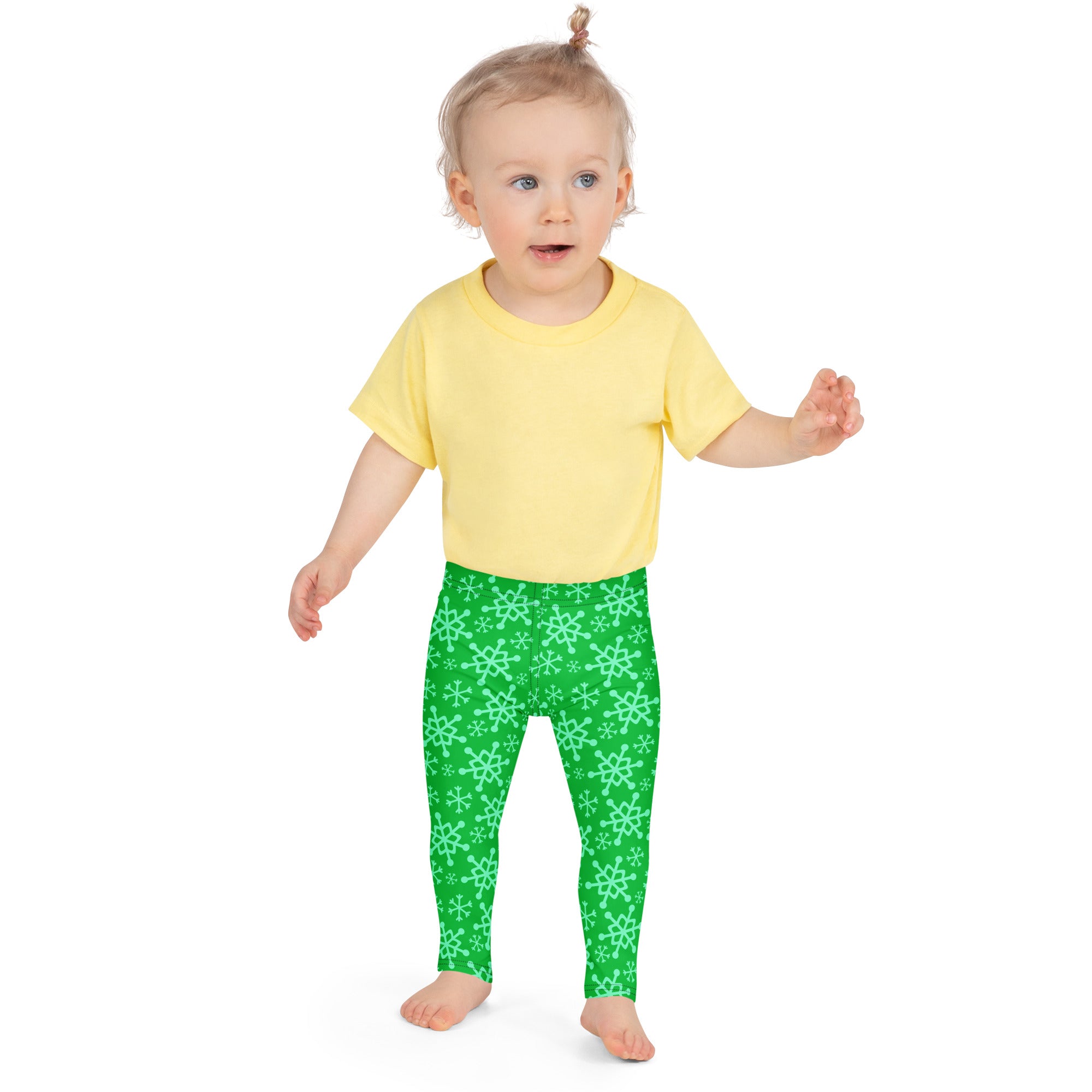 Kids green snowflake buttery soft leggings with bright green fabric and a repeating light mint snowflake pattern