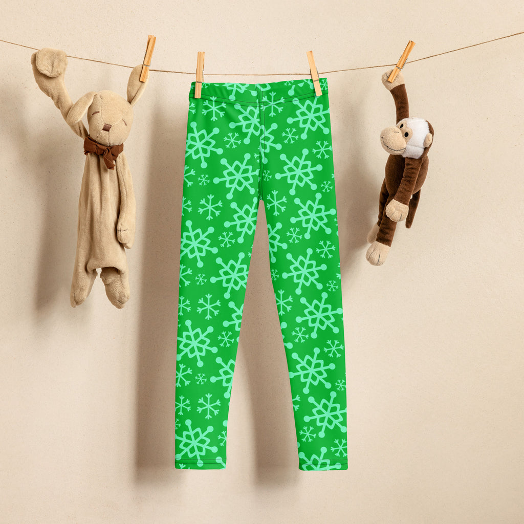Kids green snowflake buttery soft leggings with light green snowflake pattern on comfortable stretchy fabric