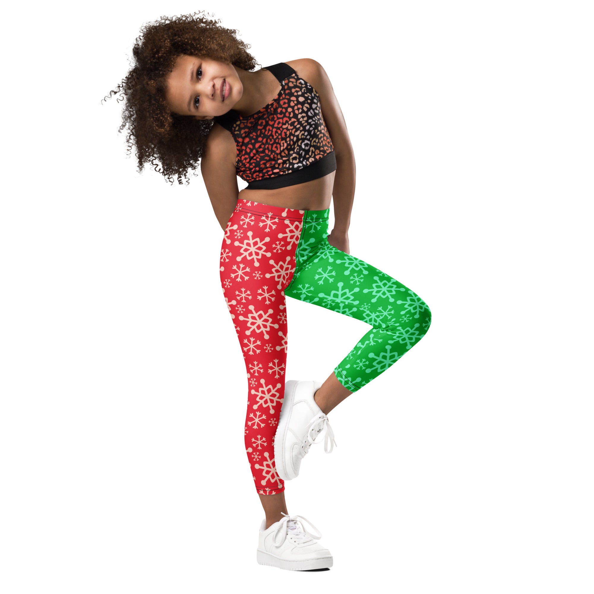 Kids red and green snowflake buttery soft leggings with split design featuring white snowflakes on each side