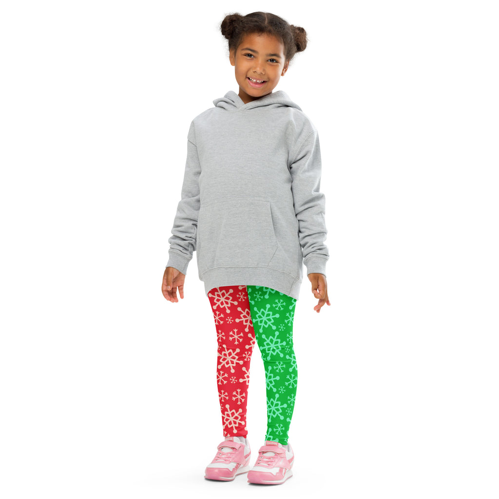 Gray hooded sweatshirt with front pocket and long sleeves worn over kids red and green snowflake buttery soft leggings