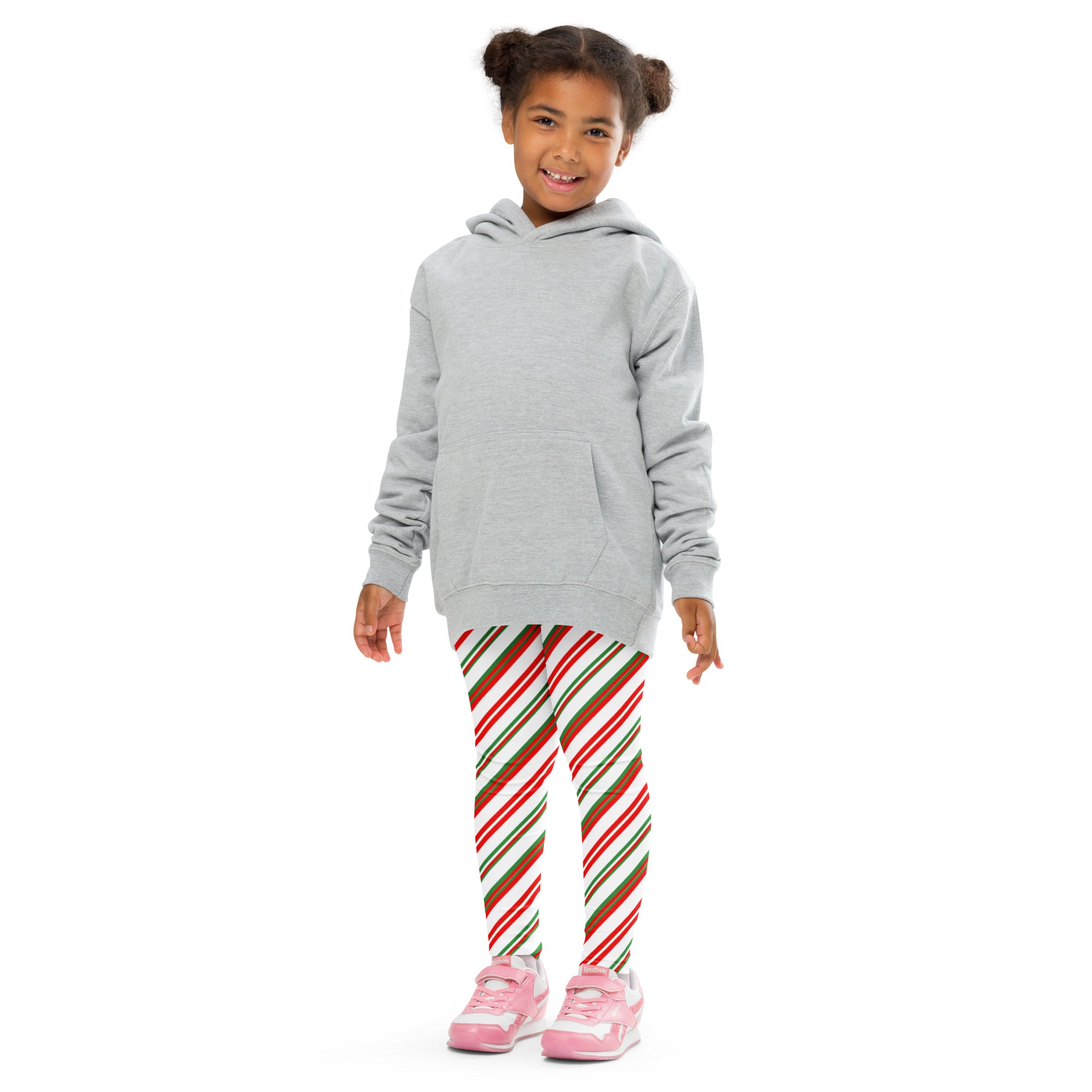 Gray hooded sweatshirt with front pocket and long sleeves paired with kids peppermint candy cane striped buttery soft leggings
