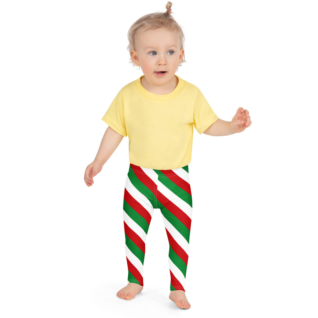 A child wearing kids red green and white christmas buttery soft leggings with diagonal stripes