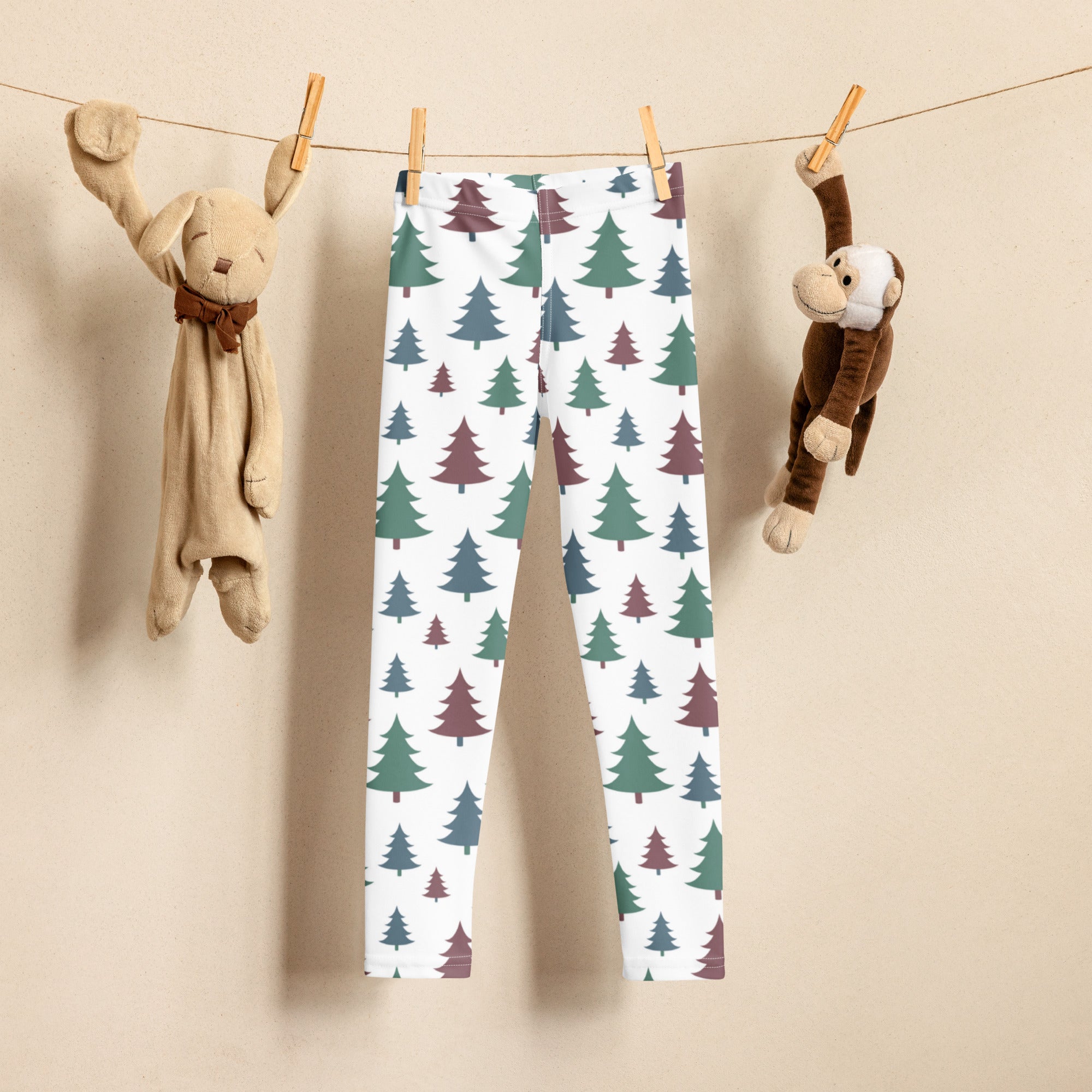 Kids pine tree winter buttery soft white leggings with green and maroon pine tree pattern for cozy cold days