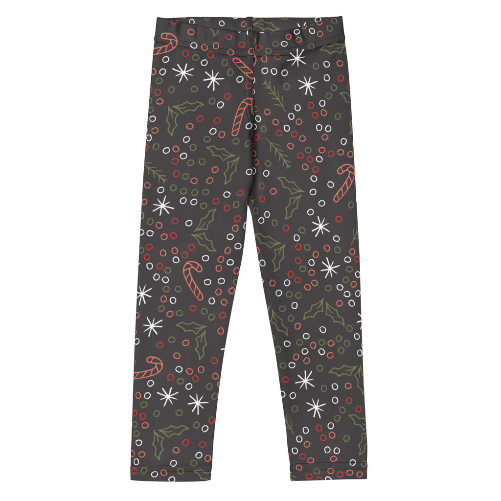 Dark gray kids christmas leggings with candy canes holly leaves snowflakes and berries in buttery soft fabric