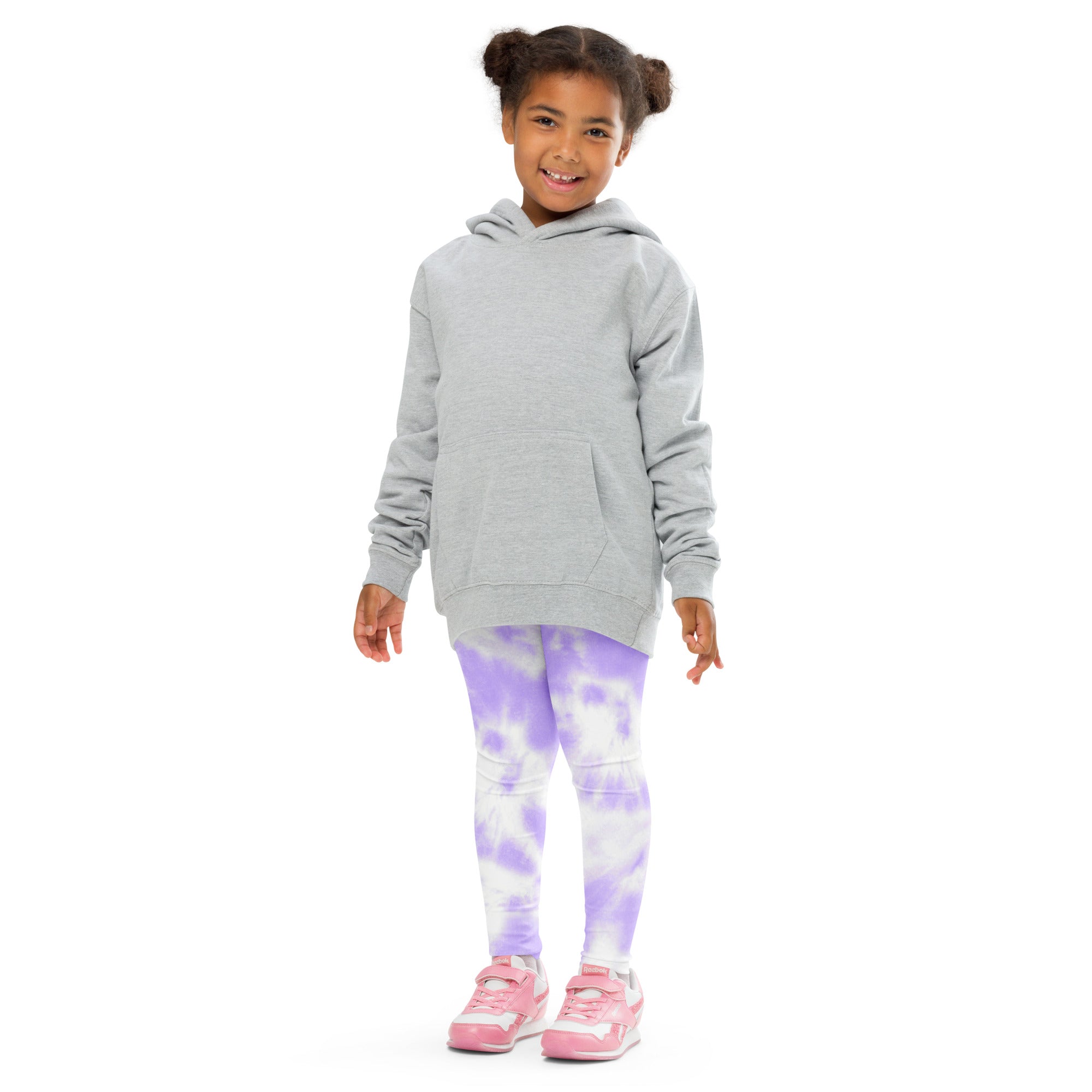 A child wearing girls lavender tie dye buttery soft leggings paired with a light gray hooded sweatshirt
