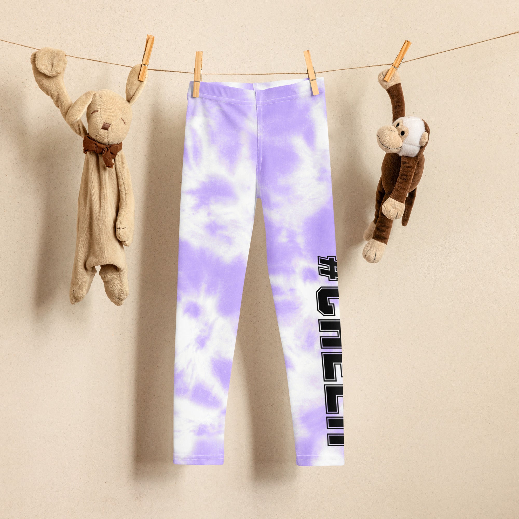 Girls custom lavender tie dye buttery soft leggings with black vertical text on the side in purple and white
