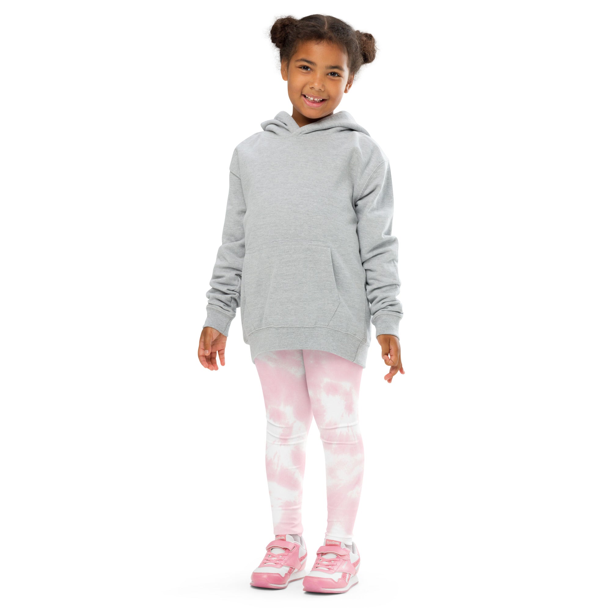 A child wearing girls pink tie dye buttery soft leggings paired with a light gray hooded sweatshirt