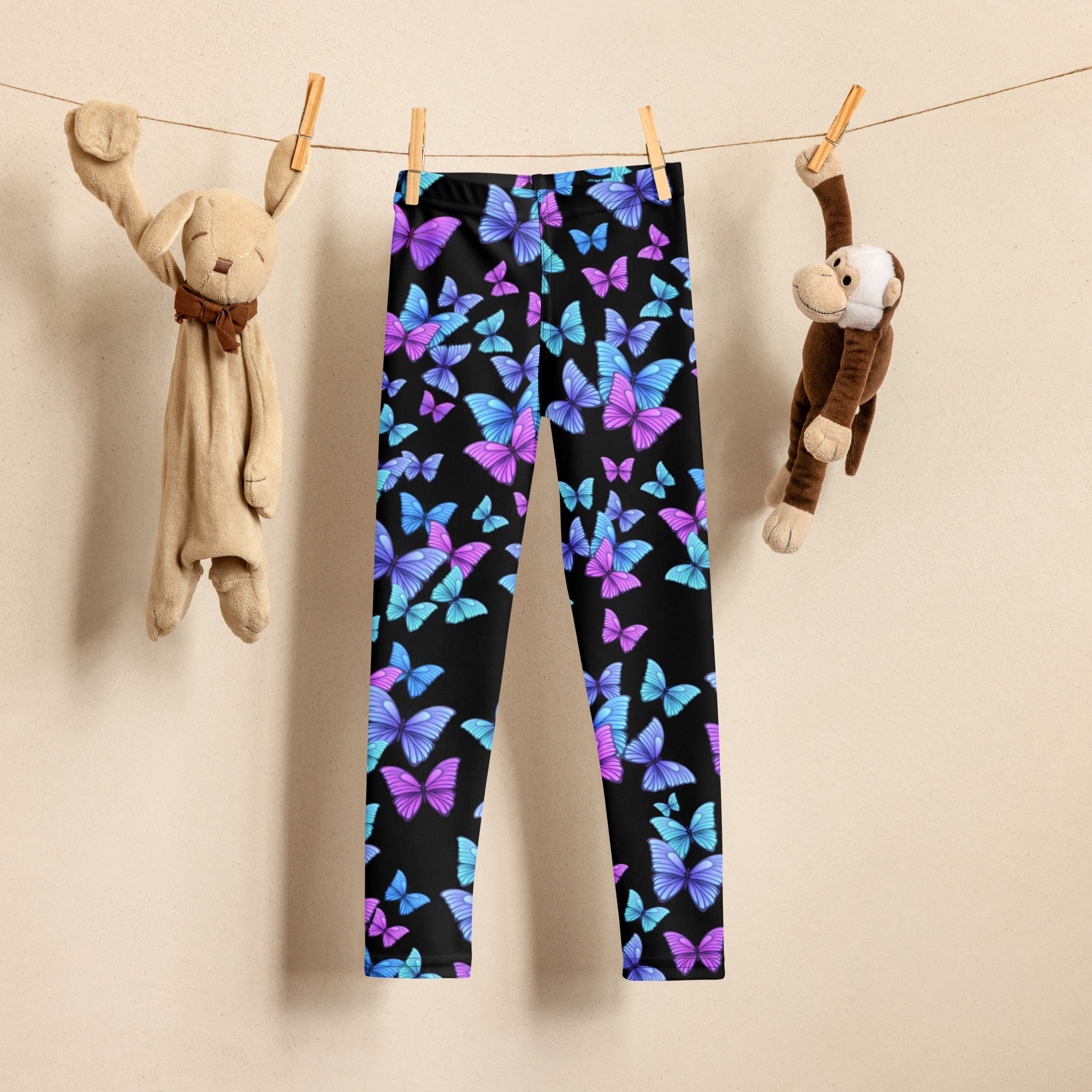 Girls vibrant butterfly buttery soft black leggings with purple and blue butterfly pattern for comfortable wear