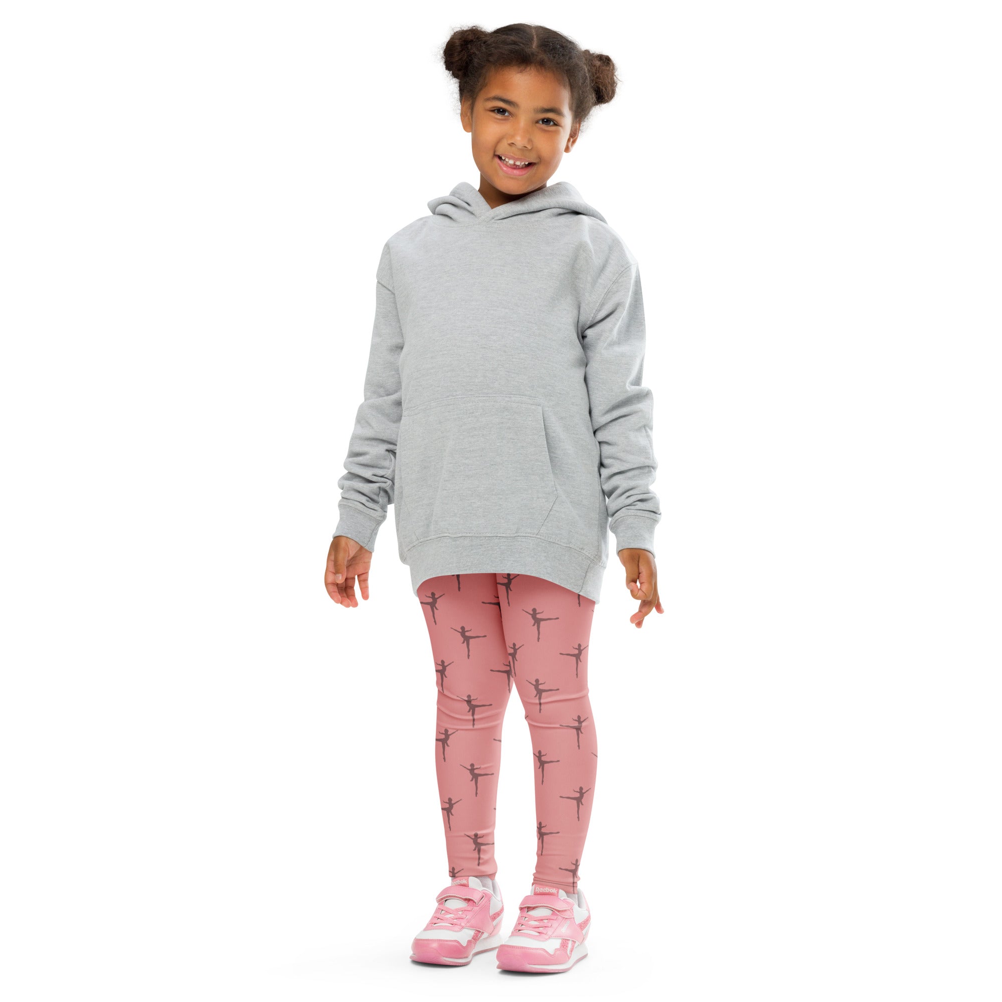 A child wearing girls pink dance buttery soft leggings with black ballet dancer prints and a light gray hooded sweatshirt