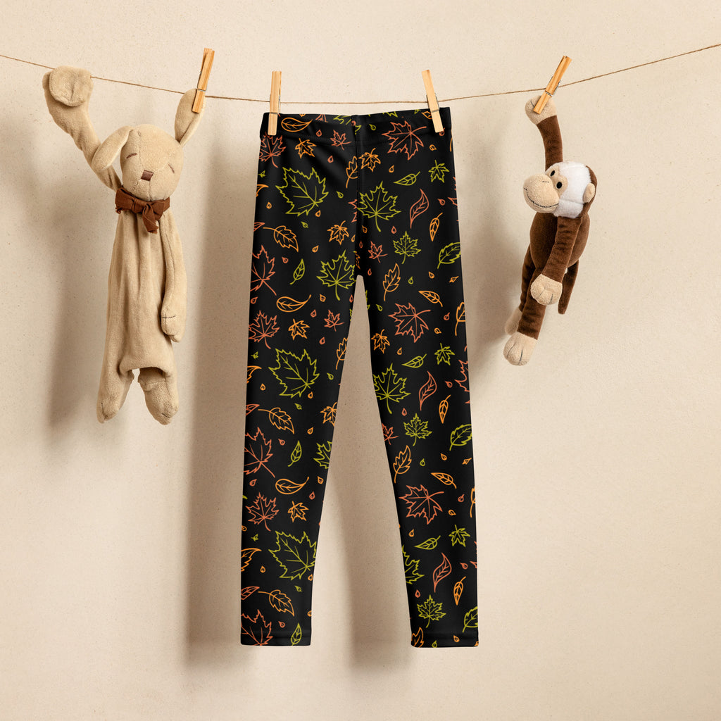 Black kids leggings with vibrant neon green orange and yellow autumn leaf pattern buttery soft fabric