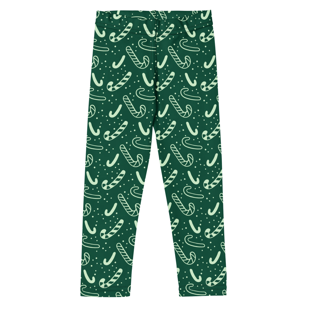 Kids green candy cane buttery soft leggings with dark green fabric and playful white candy cane pattern