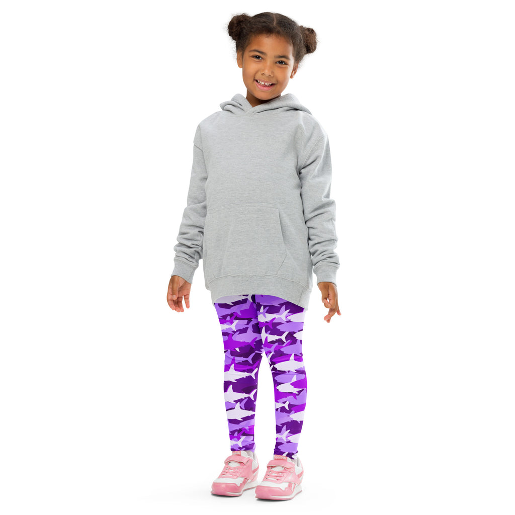 Girl wearing gray hooded sweatshirt with long sleeves and front pocket over purple shark camouflage buttery soft leggings