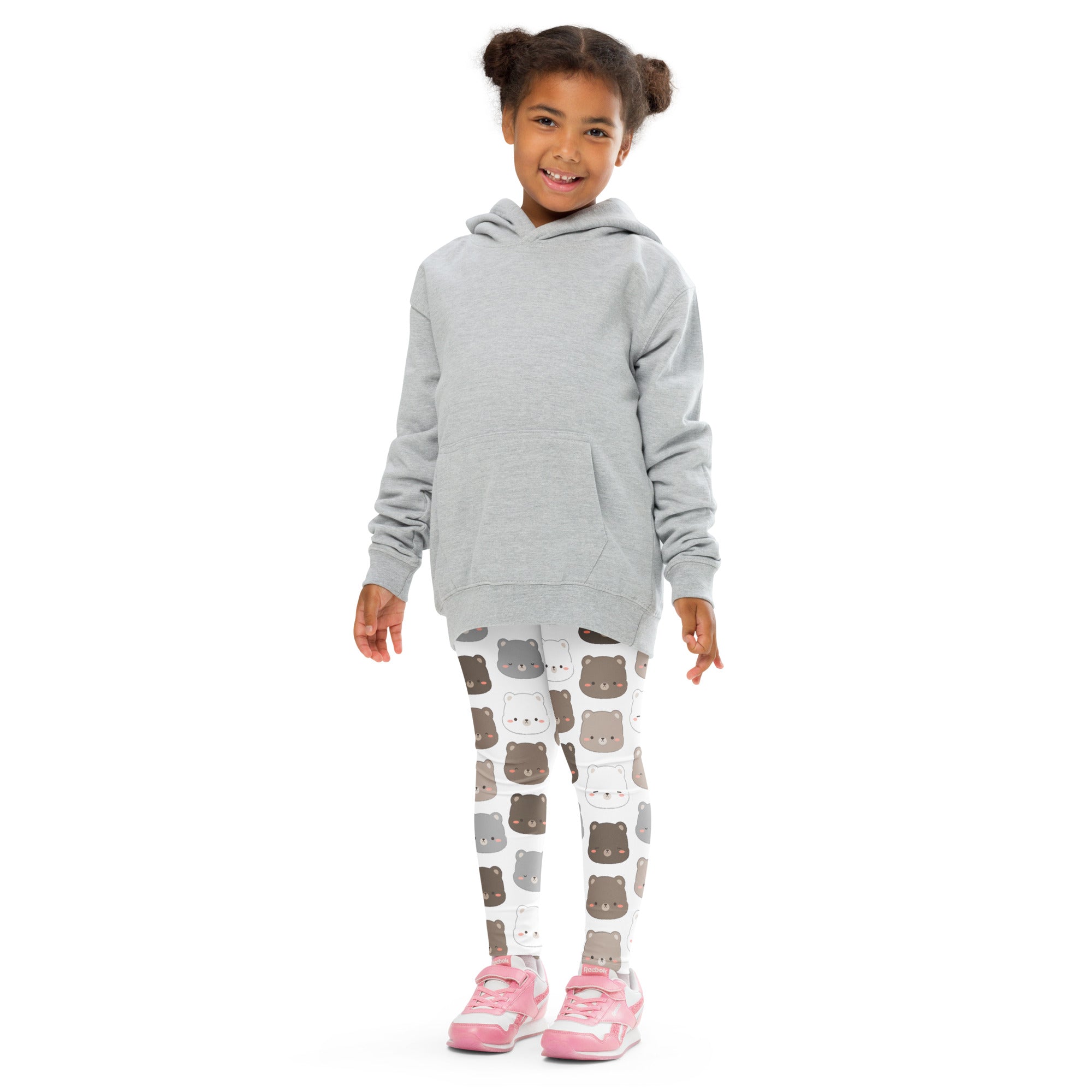A child wearing kids bear face pattern buttery soft white leggings with colorful bear faces and a light gray hoodie