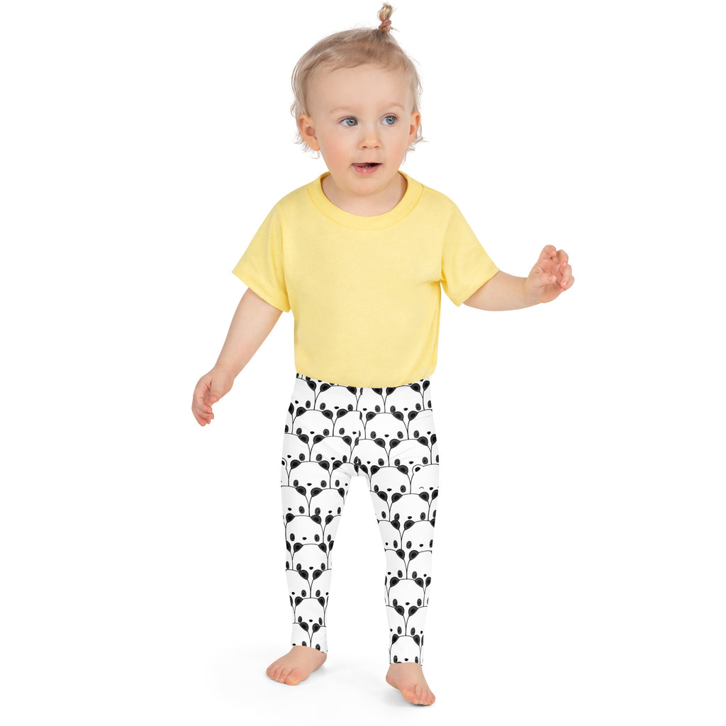 Yellow short-sleeved t-shirt paired with kids black and white panda buttery soft leggings in cotton blend