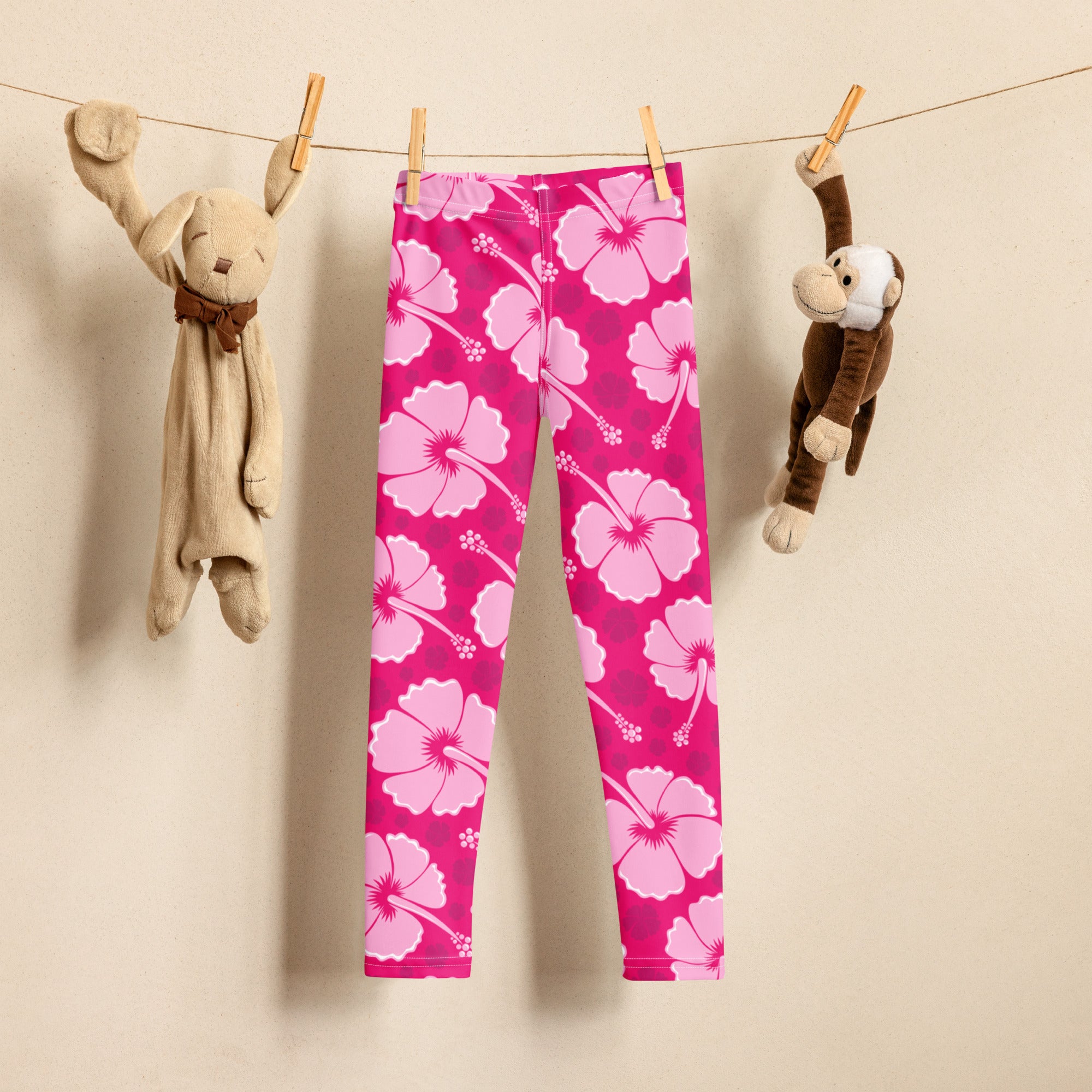 Girls tropical pink hibiscus buttery soft leggings with bright pink color and bold light pink flower pattern
