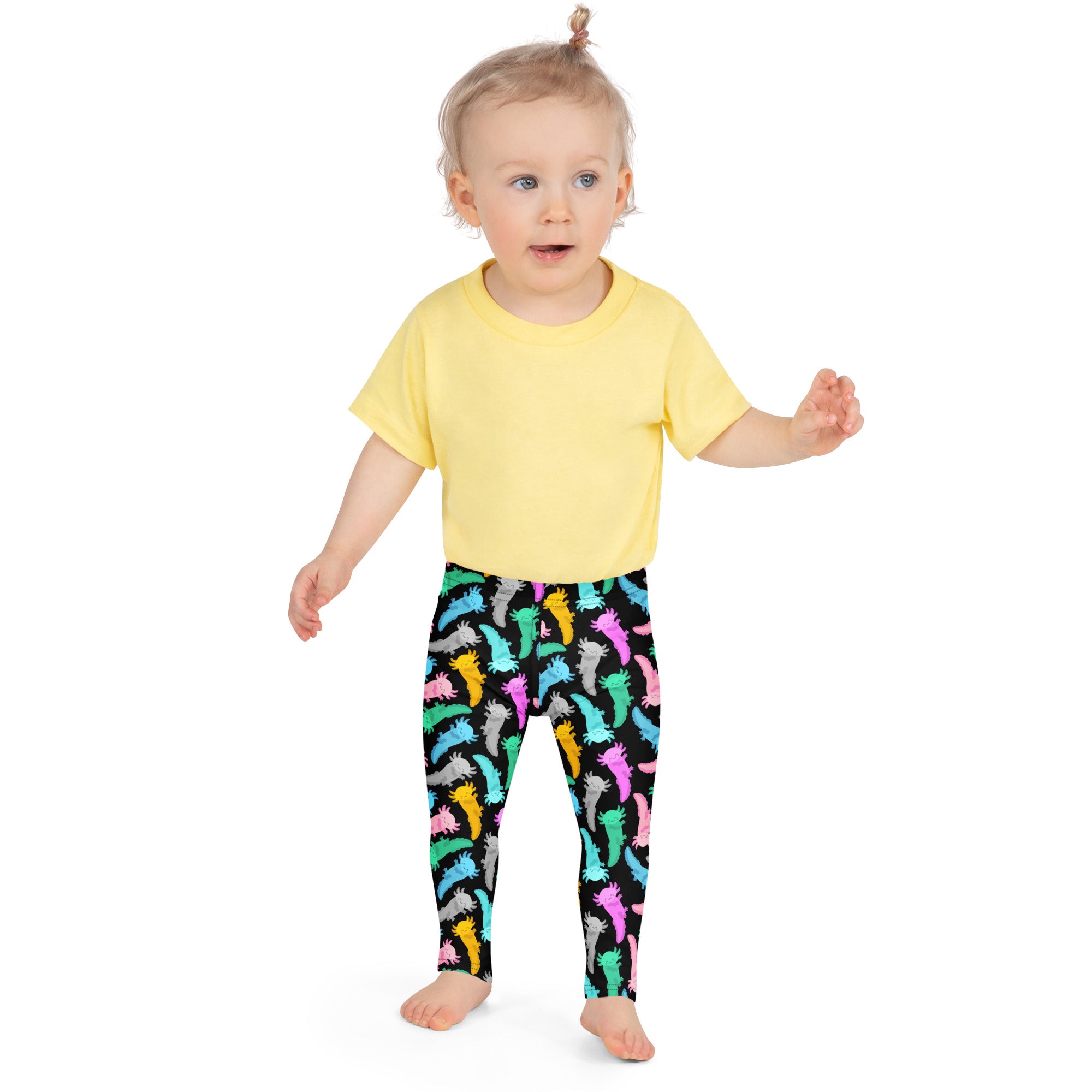 Toddler wearing bright yellow short-sleeved t-shirt paired with colorful buttery soft axolotl leggings