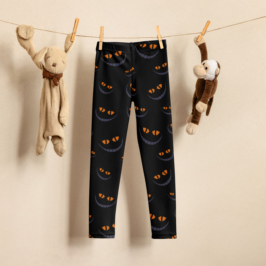 Black kids halloween leggings with gray and orange grinning cat eyes buttery soft fabric