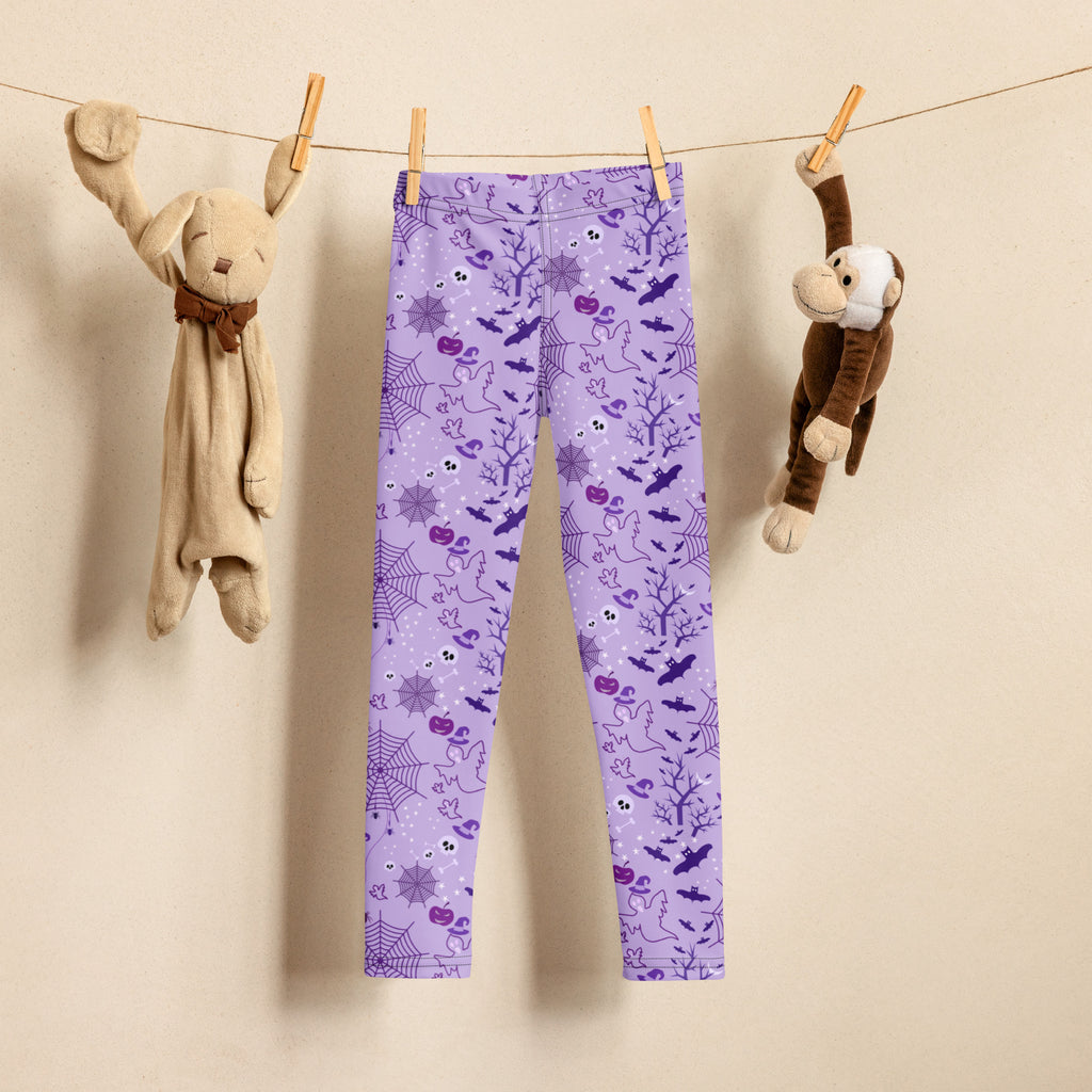 Kids purple halloween buttery soft leggings featuring a pattern of spiders bats ghosts and pumpkins