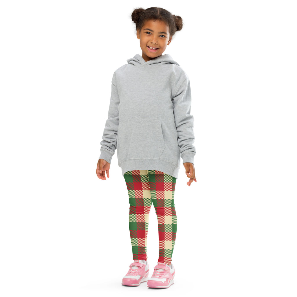 Child wearing a gray long sleeve hooded sweatshirt with front pocket paired with kids christmas plaid leggings
