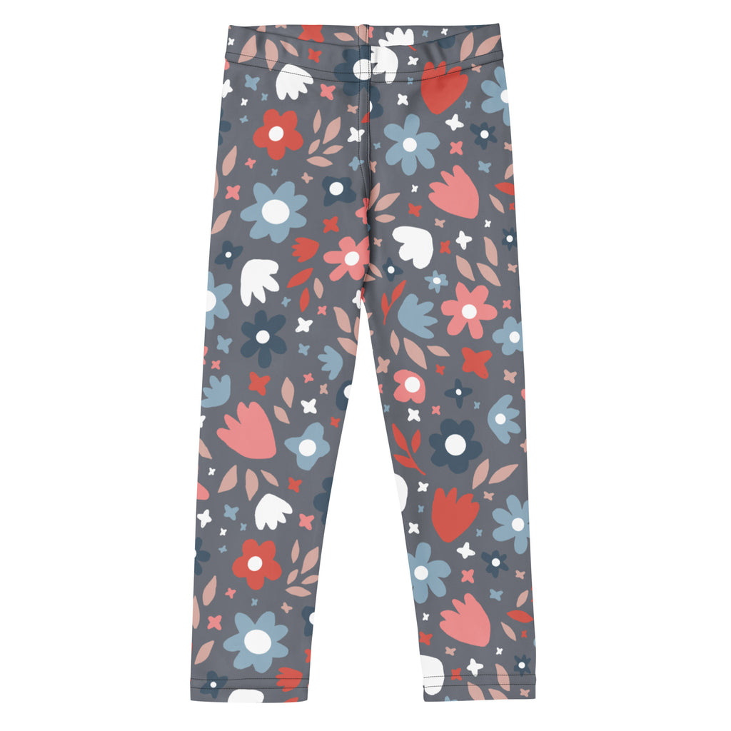 Girls gray leggings with a playful red pink blue and white floral pattern and leaf accents in buttery soft fabric