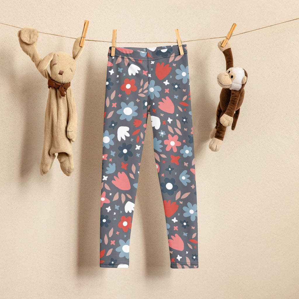 Girls gray buttery soft leggings with a colorful floral pattern featuring red pink blue and white flowers