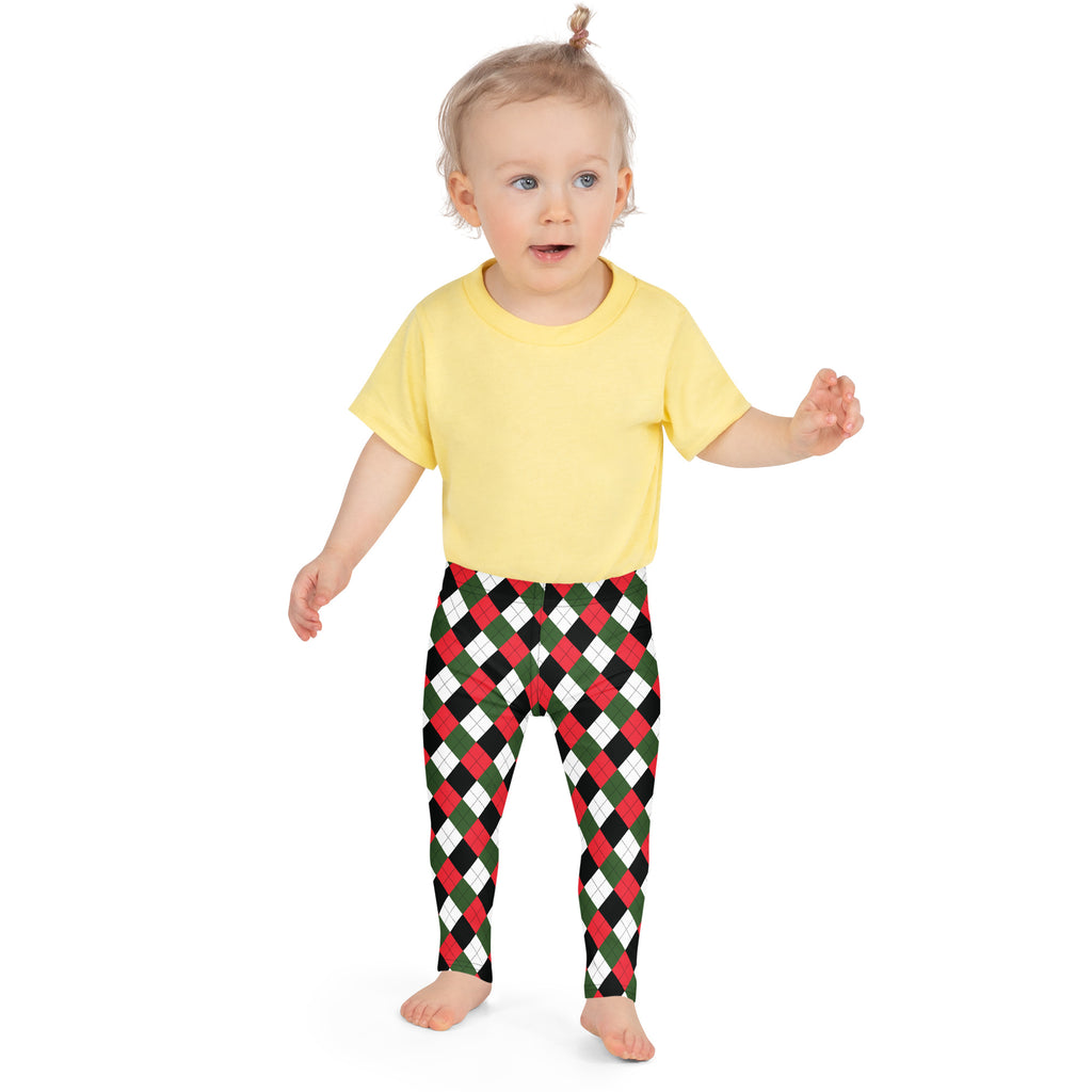 Child wearing kids red and green argyle buttery soft leggings with festive red green and white pattern