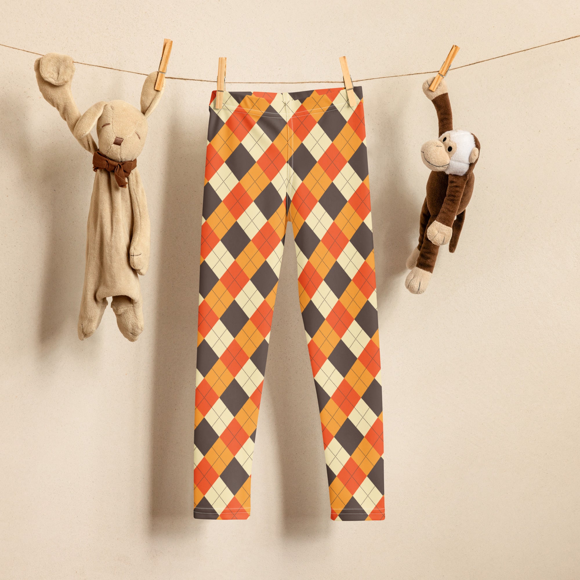 Kids fall argyle buttery soft leggings with vibrant orange gray and cream argyle pattern in soft fabric