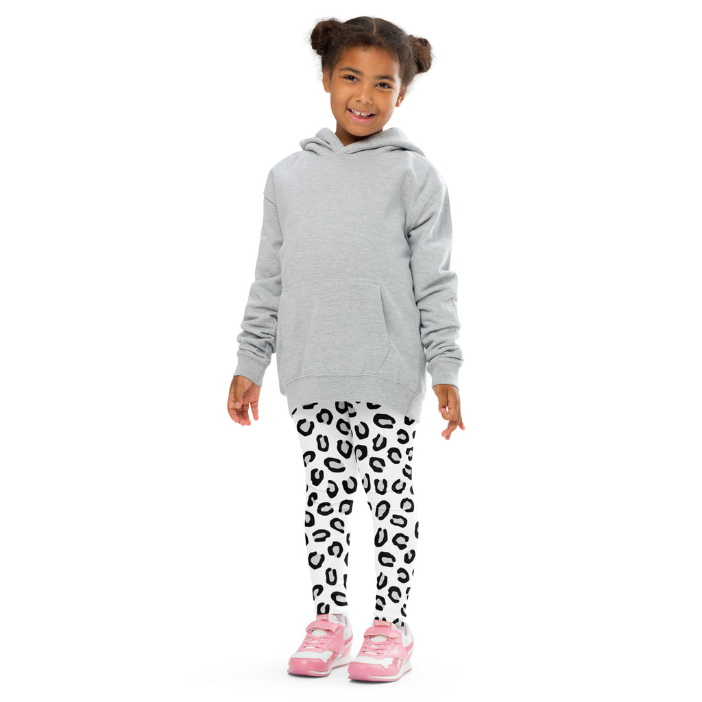 Gray hooded sweatshirt with long sleeves and front pocket worn over girls black and white leopard print buttery soft leggings