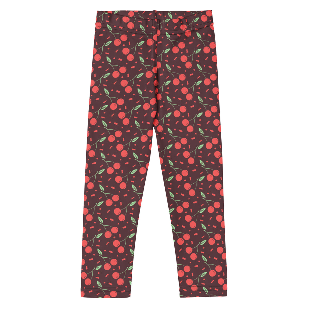 Girls cherry print buttery soft leggings in dark red with bright pink cherries green leaves and confetti dots pattern