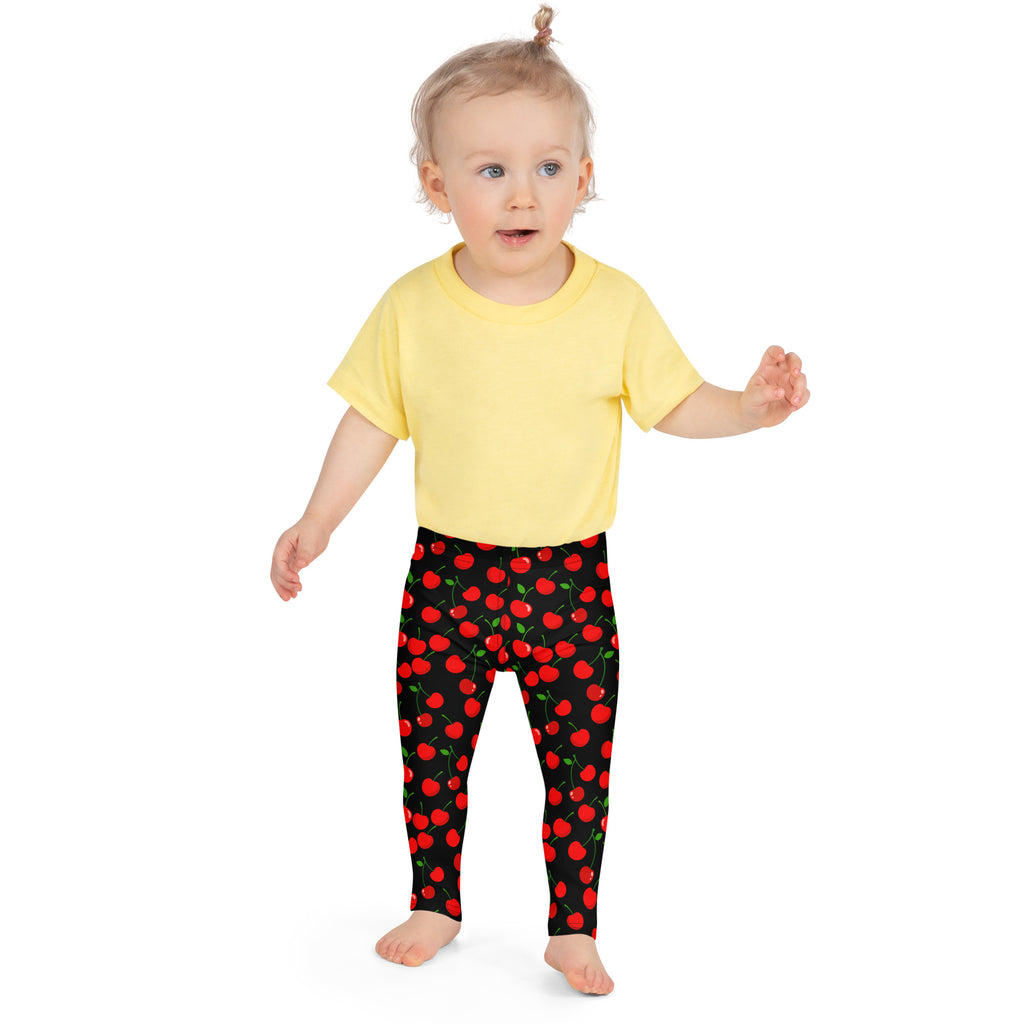 Girls black cherry buttery soft leggings featuring vibrant red cherry pattern on black fabric