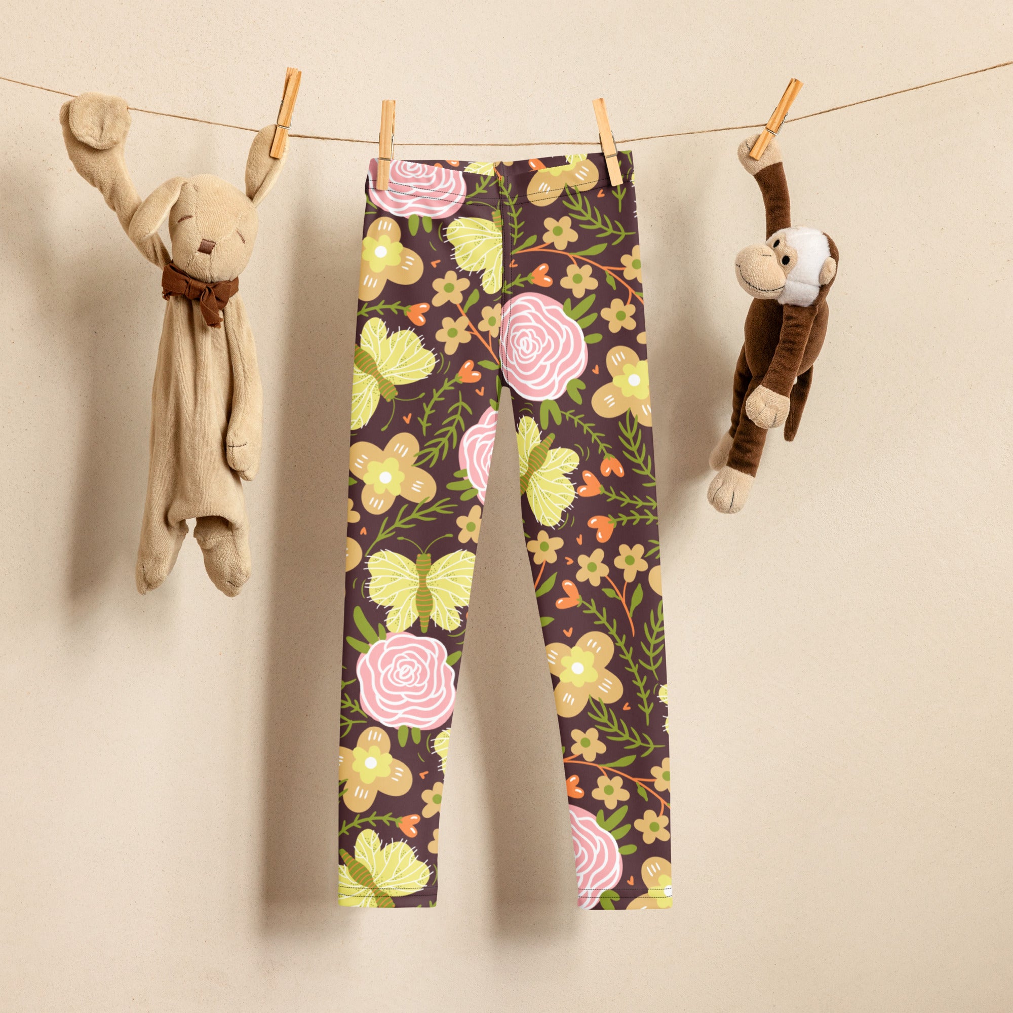 Girls brown floral buttery soft leggings with dark brown base pink roses yellow butterflies and green foliage pattern