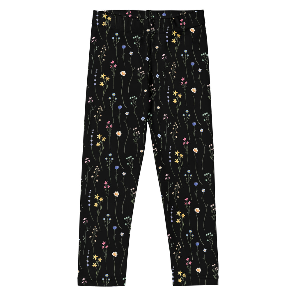 Girls black wildflower buttery soft leggings with delicate yellow pink purple and white floral pattern on dark background