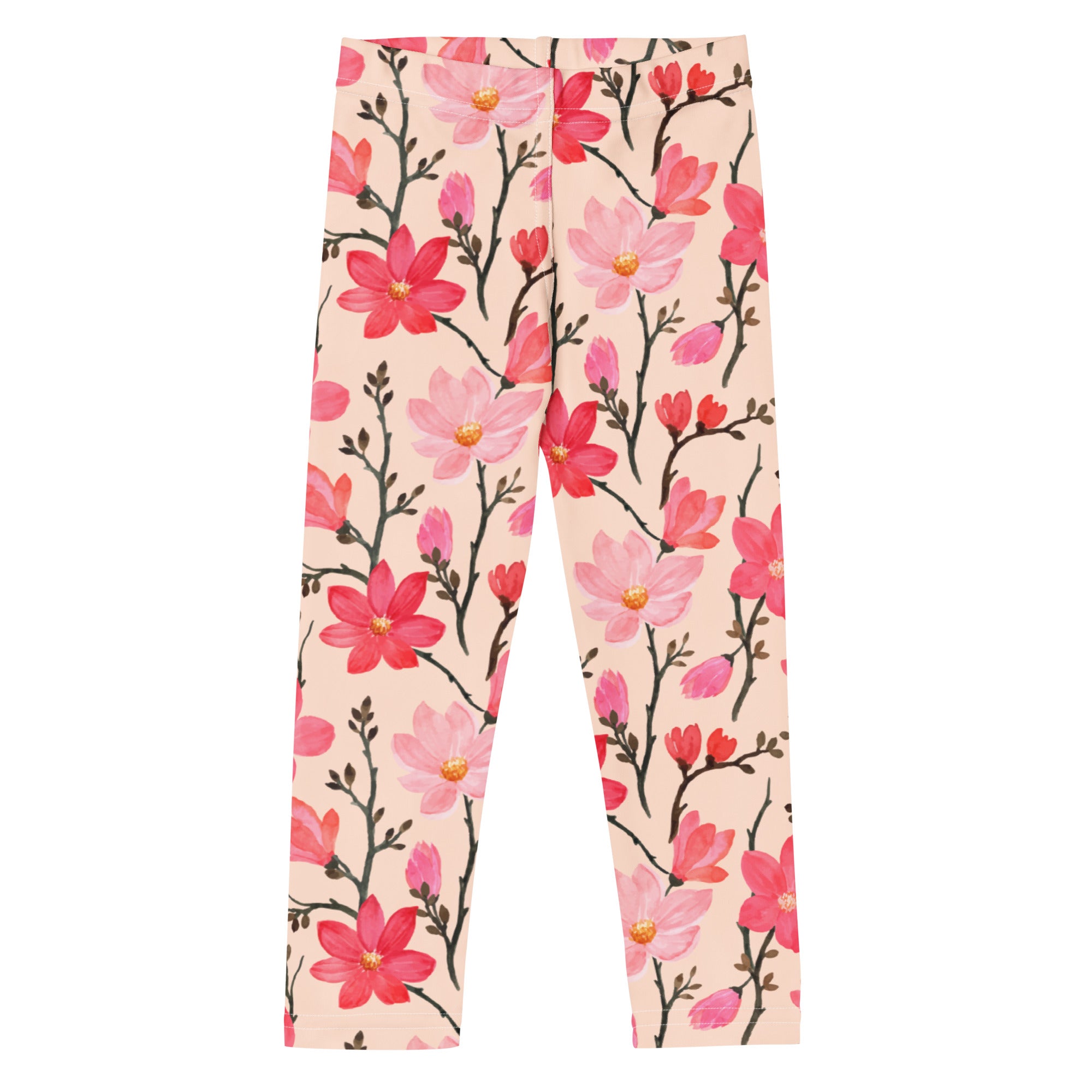 Girls pink watercolor floral buttery soft leggings featuring a magnolia pattern on a light peach background