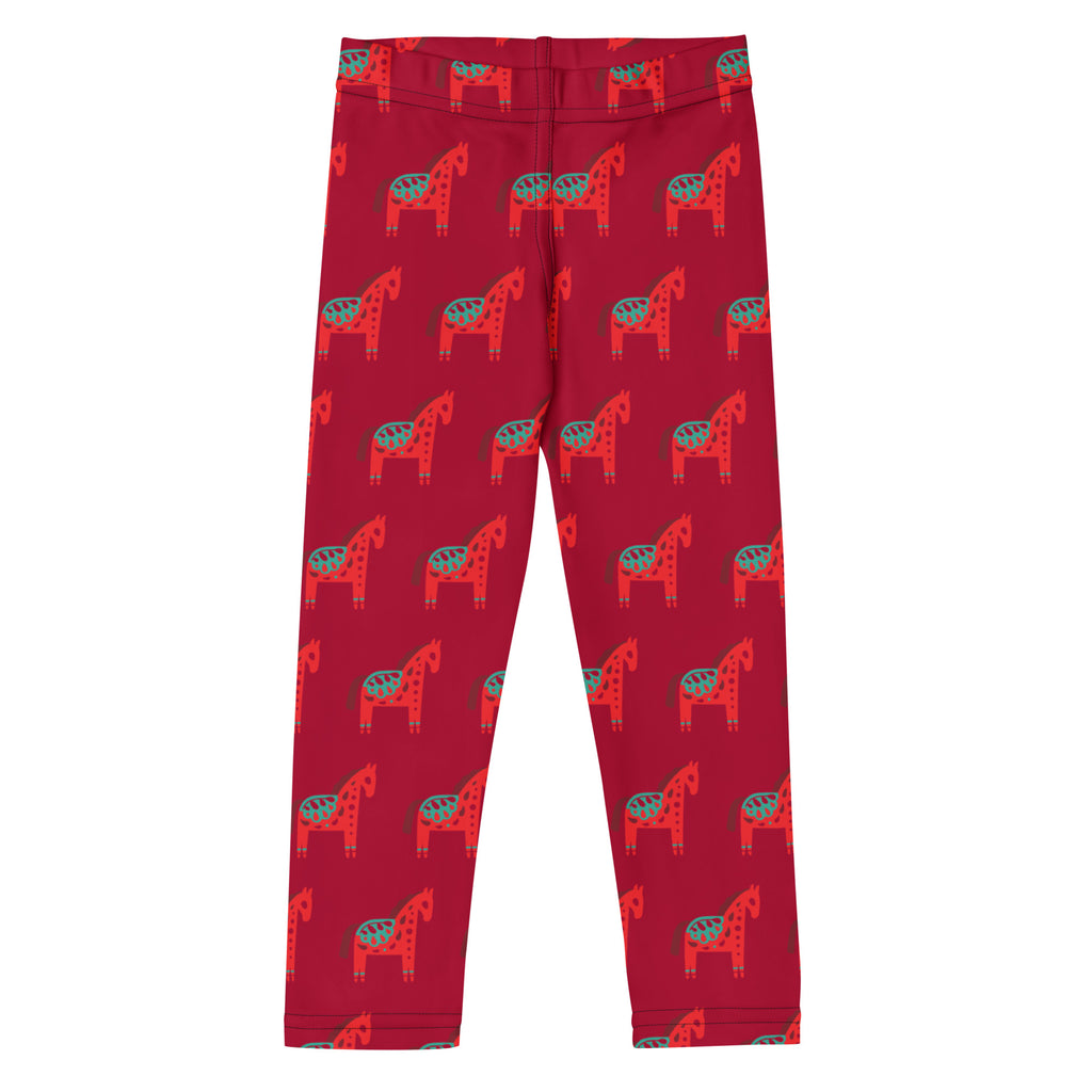 Girls scandi horse Christmas buttery soft red leggings with a repeating pattern of stylized red and teal horses