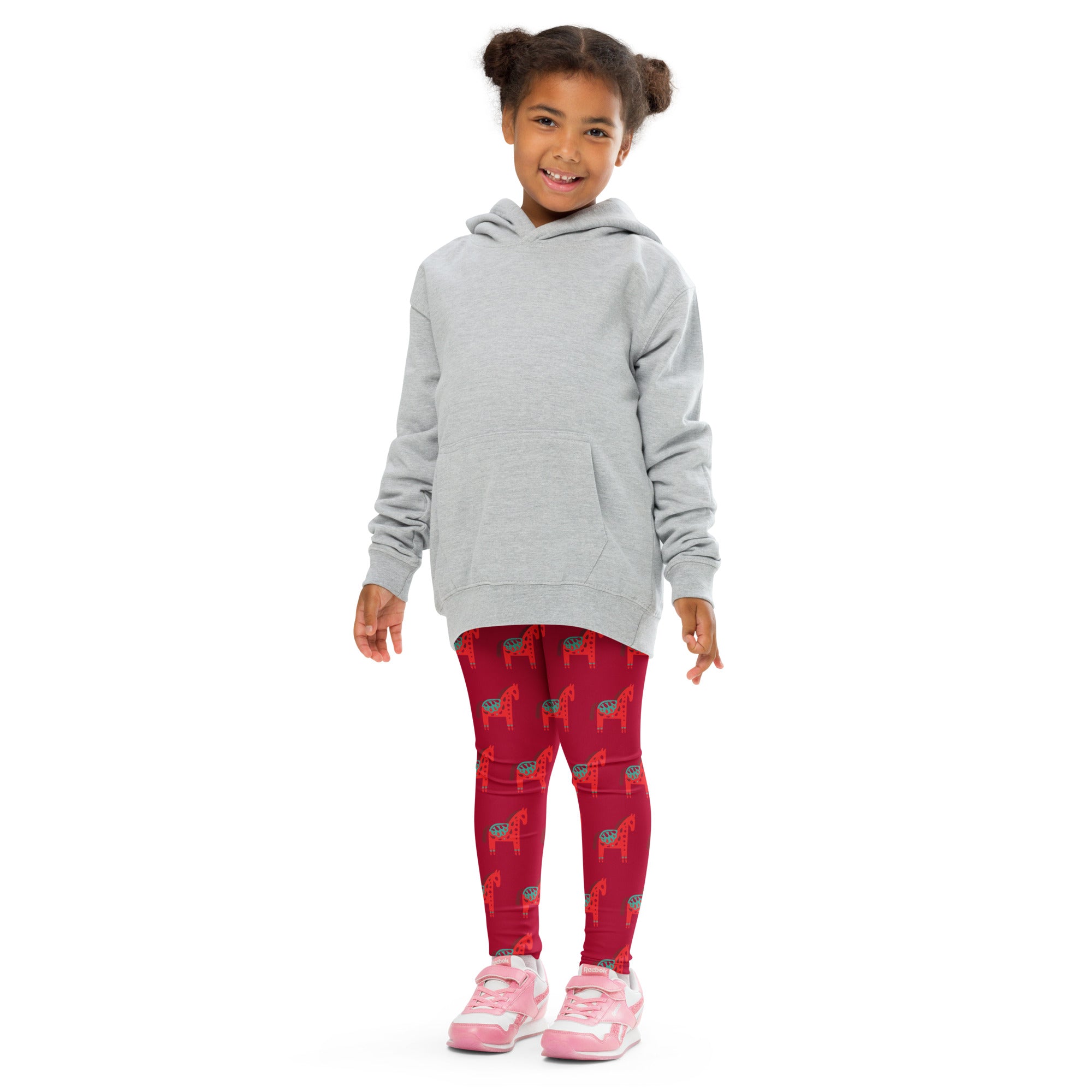 Gray hooded sweatshirt with front pocket and long sleeves paired with girls scandi horse christmas buttery soft leggings