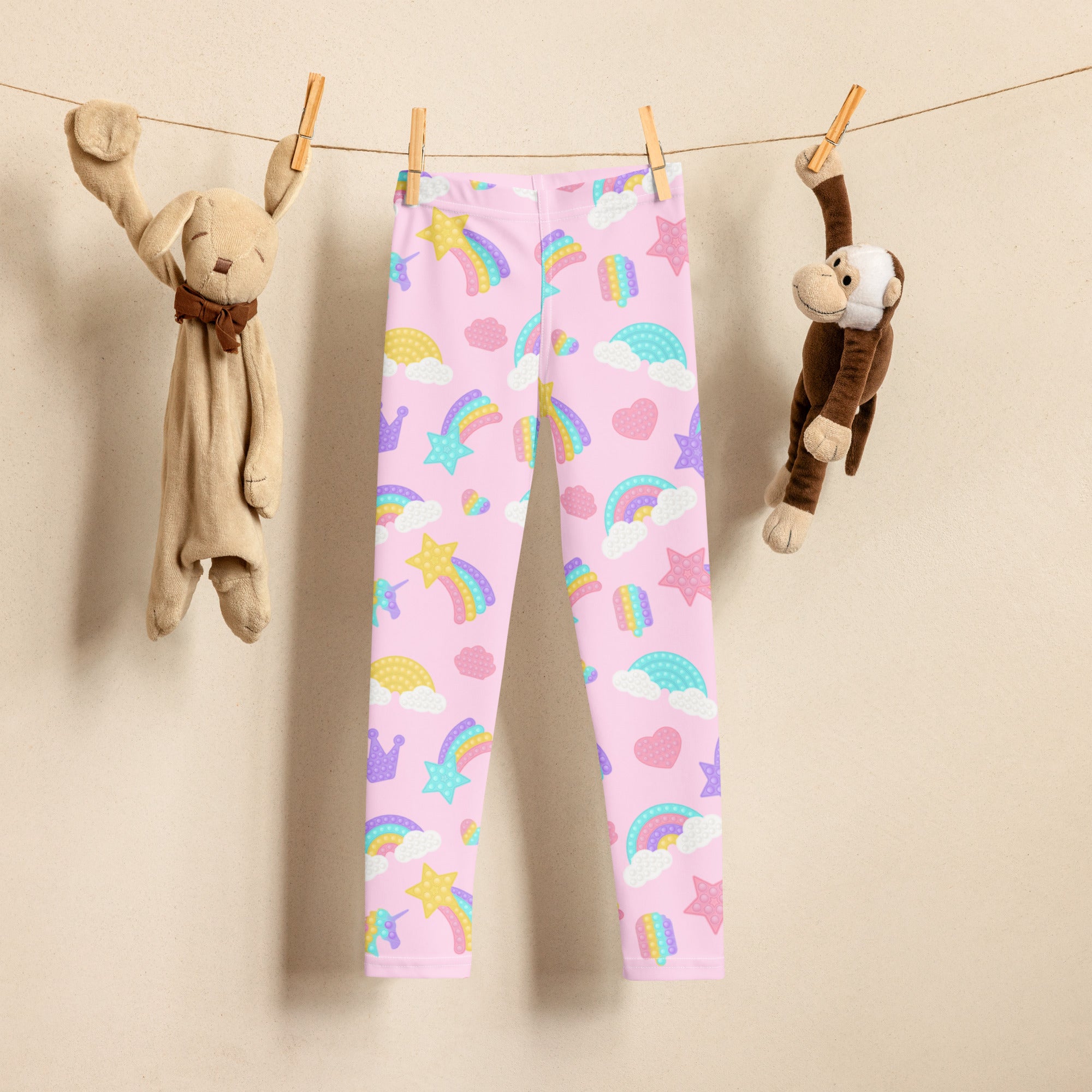 Girls fidget toy themed rainbow buttery soft pink leggings with pastel rainbows stars hearts and clouds pattern