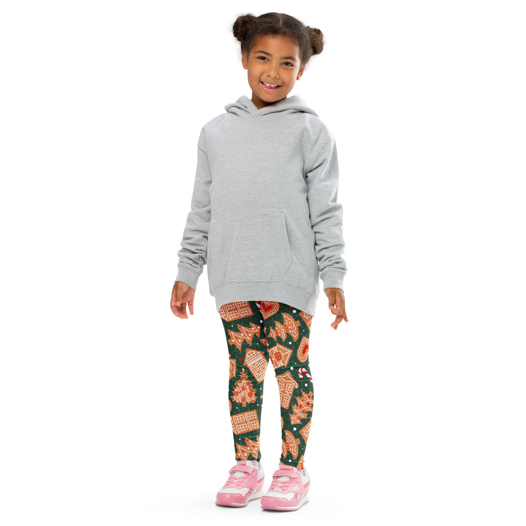 Gray hooded sweatshirt with front pocket and long sleeves paired with kids green gingerbread cookie Christmas leggings