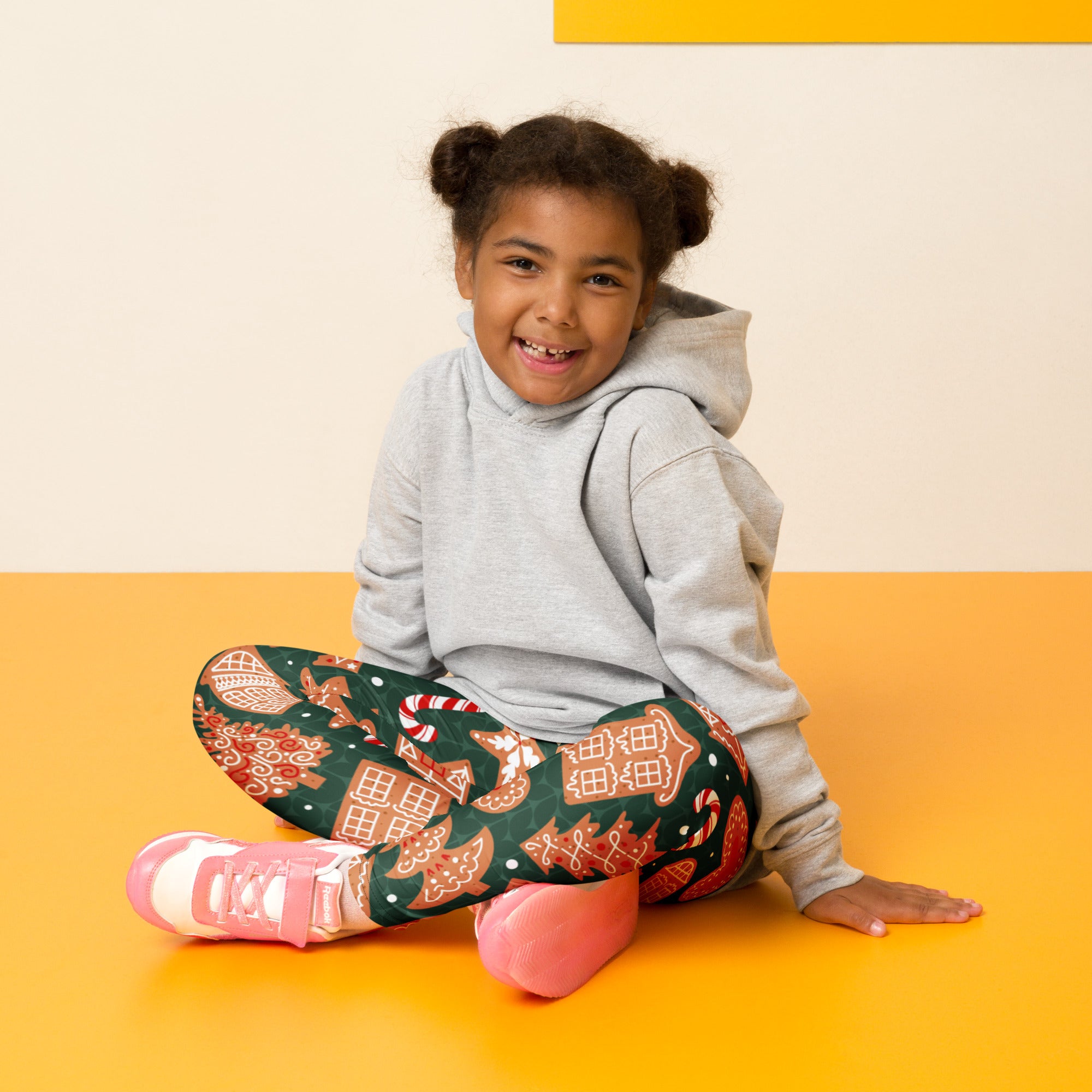 Kids green gingerbread cookie christmas buttery soft leggings with festive red white and gold gingerbread house patterns